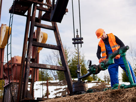 A Walters Well Drilling LLC technician installing a high-efficiency submersible water pump into a residential well casing in South Central Pennsylvania.